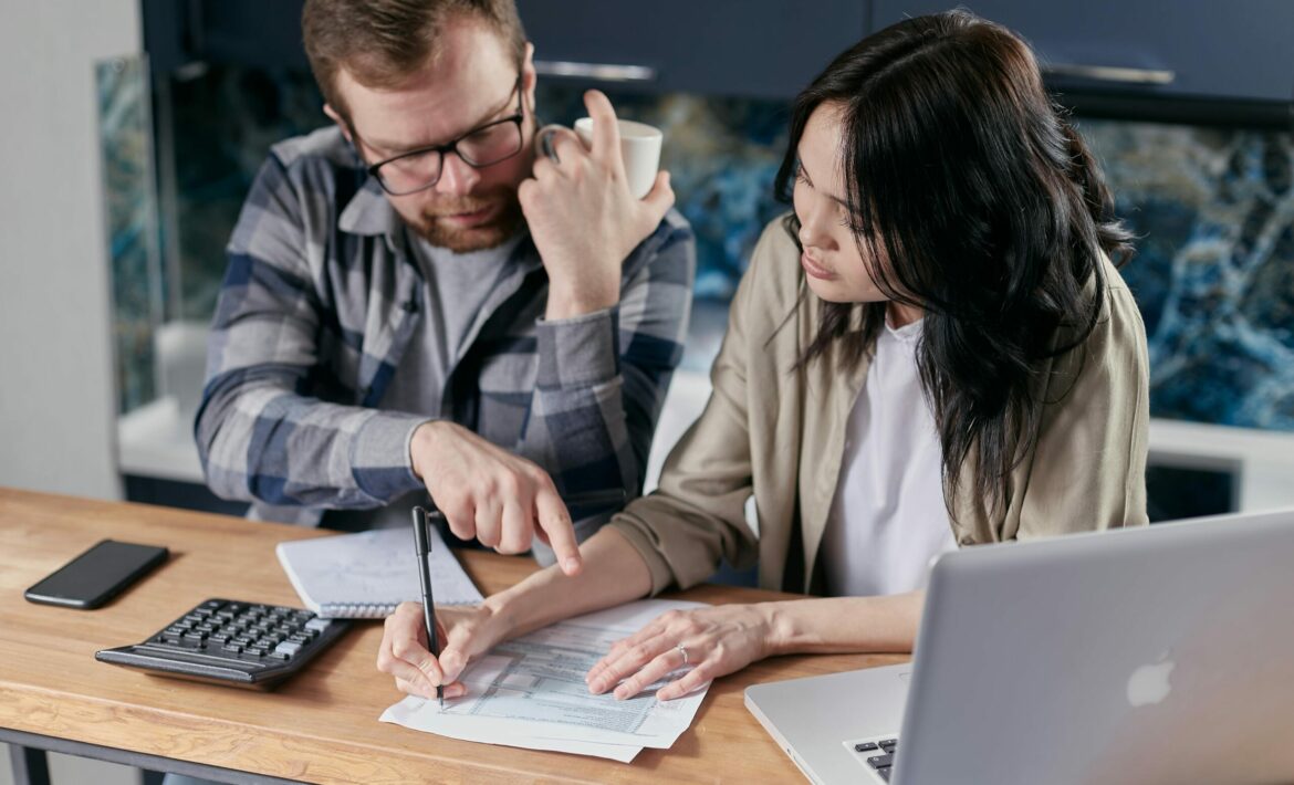 Free couple calculating al their bills stock photo